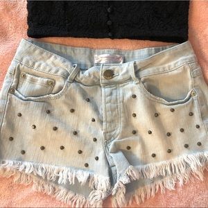 Low rise denim cut off shorts with studs